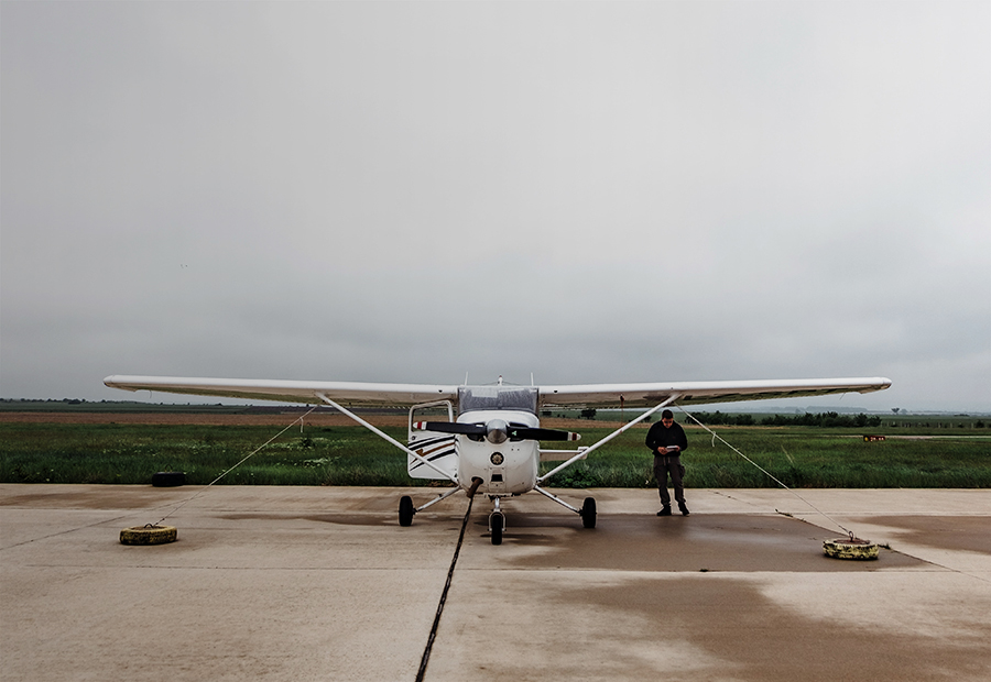 Aviation, Single engine airplane docked on a cloudy day 900x620